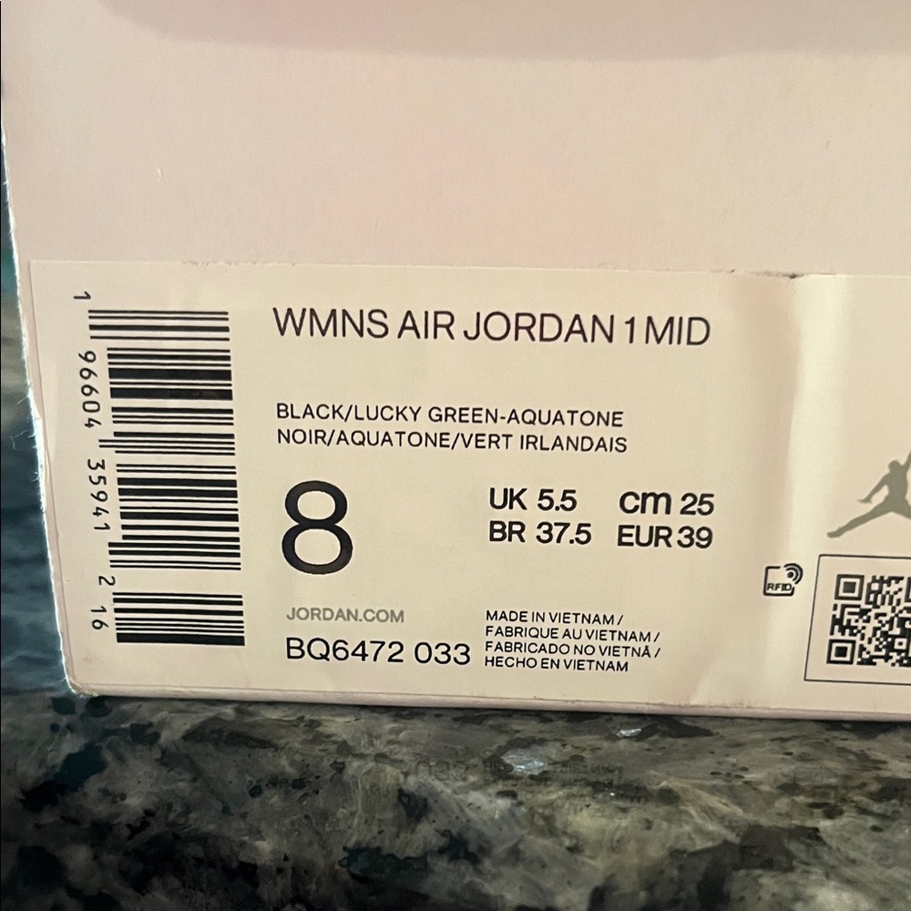 Jordan Air 1 Mid Black and Lucky Green